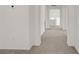 Hallway with neutral paint and carpet, and decorative architectural features at 7255 Bold Rock Ave, Las Vegas, NV 89113