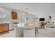 Bright kitchen featuring granite countertops, an island with seating, and stainless steel appliances at 7255 Bold Rock Ave, Las Vegas, NV 89113