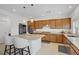 Modern kitchen featuring stainless steel appliances, granite countertops, and island seating at 7255 Bold Rock Ave, Las Vegas, NV 89113