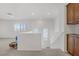 Landing area featuring neutral carpet, a banister, and brown built-in cabinets at 7255 Bold Rock Ave, Las Vegas, NV 89113