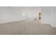 Large living room offers neutral carpet, white walls, with lots of natural lighting at 7255 Bold Rock Ave, Las Vegas, NV 89113