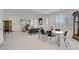 Open floor plan showcasing a dining area flowing into a seating area; light and bright at 7255 Bold Rock Ave, Las Vegas, NV 89113