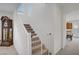 Staircase with white railings and a baby gate for added safety at 7255 Bold Rock Ave, Las Vegas, NV 89113