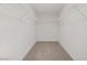 Spacious walk-in closet with wire shelving and carpeted floor at 7255 Bold Rock Ave, Las Vegas, NV 89113