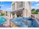 Inviting backyard featuring a refreshing pool and relaxing hot tub, perfect for outdoor entertaining at 7333 Painted Shadows Way, Las Vegas, NV 89149