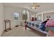 Bedroom boasting a 4 poster bed, ample natural light, and mirrored closet doors at 7333 Painted Shadows Way, Las Vegas, NV 89149