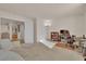 Comfortable bonus room featuring a desk, bookcase, and a sofa at 7333 Painted Shadows Way, Las Vegas, NV 89149