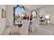 Elegant dining room featuring a marble table, upholstered chairs, and a chandelier at 7333 Painted Shadows Way, Las Vegas, NV 89149