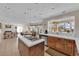Bright kitchen with an island cooktop and views into the living spaces at 7333 Painted Shadows Way, Las Vegas, NV 89149