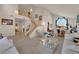Open-concept living room with vaulted ceilings and large windows, creating a bright and spacious atmosphere at 7333 Painted Shadows Way, Las Vegas, NV 89149