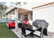 Relaxing outdoor space featuring a covered patio, hot tub, and grilling area at 7925 Limbwood Ct, Las Vegas, NV 89131