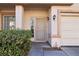 Inviting entrance with well-maintained landscaping and a charming front door, creating a warm welcome at 7925 Limbwood Ct, Las Vegas, NV 89131