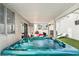 Covered hot tub in backyard oasis with ample seating and lounging options at 7925 Limbwood Ct, Las Vegas, NV 89131