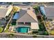 Elevated perspective of a home with a backyard oasis, pool, and covered patio for entertaining at 8298 W Agate Ave, Las Vegas, NV 89113