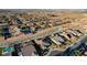 Elevated shot of a residential area displaying a mix of single-Gathering homes near a city skyline at 8298 W Agate Ave, Las Vegas, NV 89113
