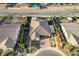 Drone photo of a home with an backyard featuring a private pool and desert landscaping at 8298 W Agate Ave, Las Vegas, NV 89113
