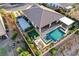 High-angle view of a property with a luxurious pool and outdoor living space, including a spa at 8298 W Agate Ave, Las Vegas, NV 89113