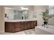 Bright bathroom with dual sinks, walk-in shower, and soaking tub at 8298 W Agate Ave, Las Vegas, NV 89113