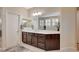 Bright bathroom featuring a walk-in shower, large soaking tub, and dual sinks at 8298 W Agate Ave, Las Vegas, NV 89113