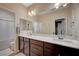 This bathroom boasts dual sinks, and a shower-tub combination at 8298 W Agate Ave, Las Vegas, NV 89113