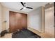 Bedroom with ample storage cabinets and hardwood flooring, set up as a fitness space at 8298 W Agate Ave, Las Vegas, NV 89113