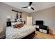 This cozy bedroom offers ample space with decor touches, and ceiling fan at 8298 W Agate Ave, Las Vegas, NV 89113