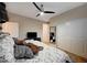 This bright bedroom offers a large bed, TV, and sizable closet space at 8298 W Agate Ave, Las Vegas, NV 89113