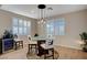 Cozy dining area showcases stylish light fixture and a modern table with seating at 8298 W Agate Ave, Las Vegas, NV 89113