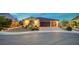 Charming single-story home with a three-car garage, well-lit entrance, and tidy landscaping at 8298 W Agate Ave, Las Vegas, NV 89113