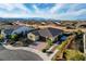 Inviting single-story home with manicured landscaping, brick driveway, and an attached two-car garage in a quiet suburb at 8298 W Agate Ave, Las Vegas, NV 89113
