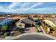 Charming single-story home featuring desert landscaping, a brick driveway, and a two-car garage in a residential area at 8298 W Agate Ave, Las Vegas, NV 89113