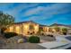 Inviting single-story home showcases well-maintained landscaping, decorative lighting, and a welcoming facade at 8298 W Agate Ave, Las Vegas, NV 89113