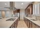Contemporary kitchen features a large island with cooktop and stainless steel appliances at 8298 W Agate Ave, Las Vegas, NV 89113