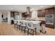 Spacious kitchen features a large island, stainless steel appliances, and wood-style flooring at 8298 W Agate Ave, Las Vegas, NV 89113