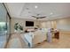 Bright living room with a modern ceiling fan, TV, and access to the backyard at 8298 W Agate Ave, Las Vegas, NV 89113