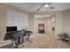 Bright office space features a stylish desk, modern chair, and window with plantation shutters at 8298 W Agate Ave, Las Vegas, NV 89113