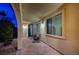 Covered patio featuring outdoor seating, stylish decor, and large windows providing ample natural light at 8298 W Agate Ave, Las Vegas, NV 89113