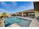 Stunning backyard pool area with an outdoor patio and serene landscaping at 8298 W Agate Ave, Las Vegas, NV 89113