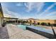 Stunning backyard with a sparkling pool, spa, and beautifully landscaped surroundings for ultimate relaxation at 8298 W Agate Ave, Las Vegas, NV 89113