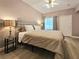 Comfortable bedroom with plush bedding, stylish lamps, and neutral tones, with view to window at 9000 S Las Vegas Blvd # 1187, Las Vegas, NV 89123