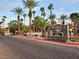 Community entrance sign with palm trees and lush landscaping at 9000 S Las Vegas Blvd # 1187, Las Vegas, NV 89123