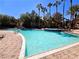 Resort-style swimming pool featuring crystal blue water and mature palm trees at 9000 S Las Vegas Blvd # 1187, Las Vegas, NV 89123