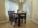 Bright dining area with a modern chandelier, wood-style flooring, and a view of the outdoors at 9000 S Las Vegas Blvd # 1187, Las Vegas, NV 89123