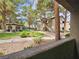 Community exterior with lush green grounds, mature trees, and a covered gazebo sitting area at 9000 S Las Vegas Blvd # 1187, Las Vegas, NV 89123