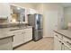 Bright kitchen features stainless steel appliances, light wood floors, and white cabinets at 9000 S Las Vegas Blvd # 1187, Las Vegas, NV 89123