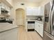 Bright kitchen features a gas range, dishwasher, and stainless-steel refrigerator at 9000 S Las Vegas Blvd # 1187, Las Vegas, NV 89123