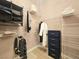 Organized walk-in closet with shelving, hanging rods, and a built-in drawer unit for optimal storage at 9000 S Las Vegas Blvd # 1187, Las Vegas, NV 89123