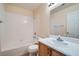 Bright bathroom featuring a shower-tub combo, vanity, and modern fixtures at 914 Calico Brook Dr, Henderson, NV 89002