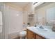 Bright bathroom featuring a shower-tub combo, vanity, and modern fixtures at 914 Calico Brook Dr, Henderson, NV 89002