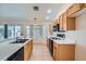 Traditional kitchen featuring wood cabinets, white countertops, and stainless steel appliances at 914 Calico Brook Dr, Henderson, NV 89002